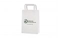 Elegant and well-designed white paper bag with flat handles... | Bildgalleri - Vita papperskassar 