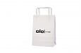 Sturdy and durable white paper bag with flat handles. Can be.. | Bildgalleri - Vita papperskassar 