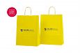 kollased paberkotid | Fotogalerii- kollased paberkotid, millele trkitud klientide logod logo peal